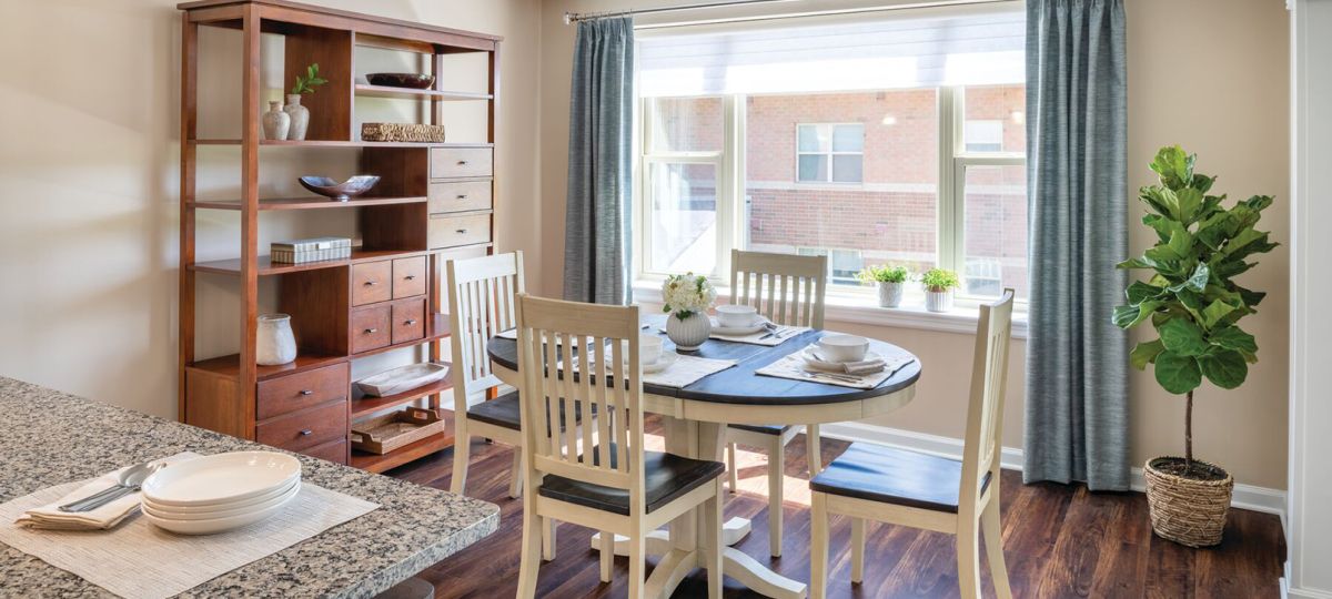 Sunny dining room in an Erickson Senior Living community apartment.