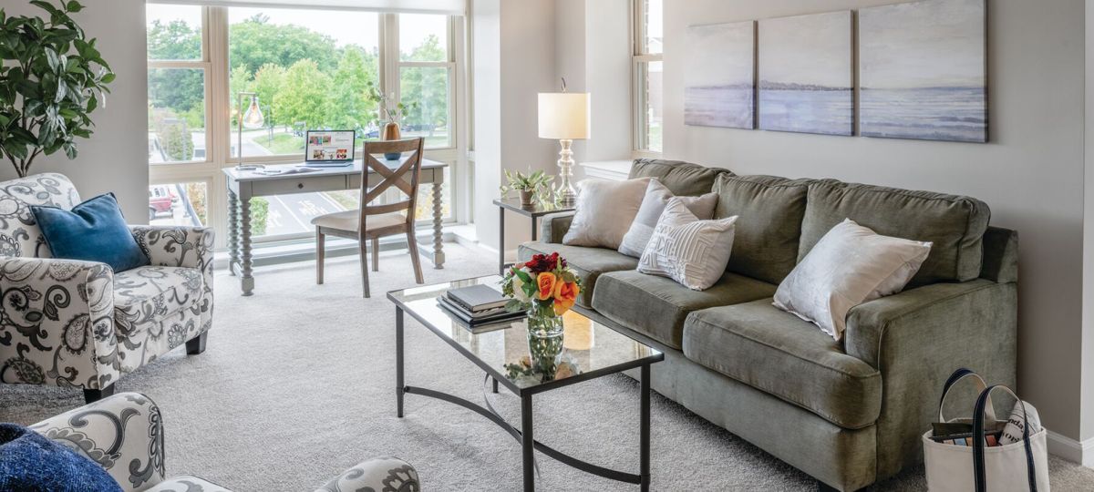 Comfortable and well-furnished living room in an Erickson Senior Living community apartment.