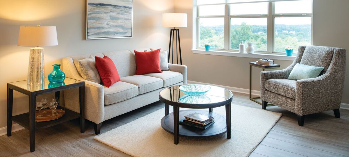 Comfortable and well-furnished living room in an Erickson Senior Living community apartment.
