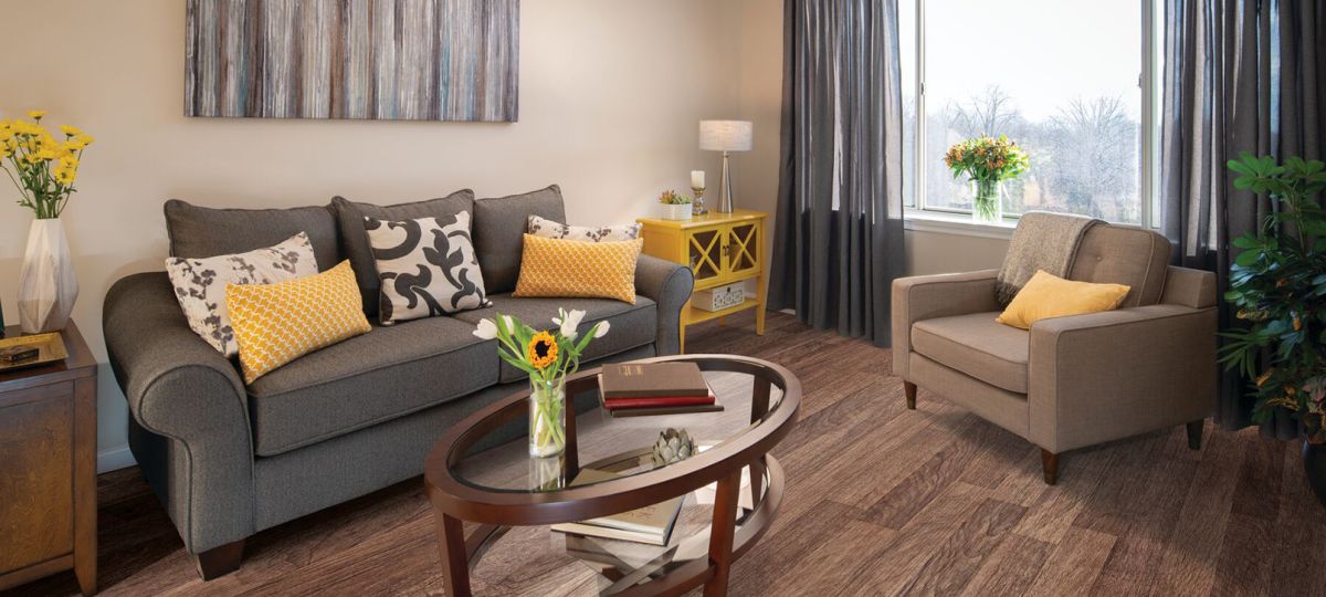 Comfortable and well-furnished living room in an Erickson Senior Living community apartment.