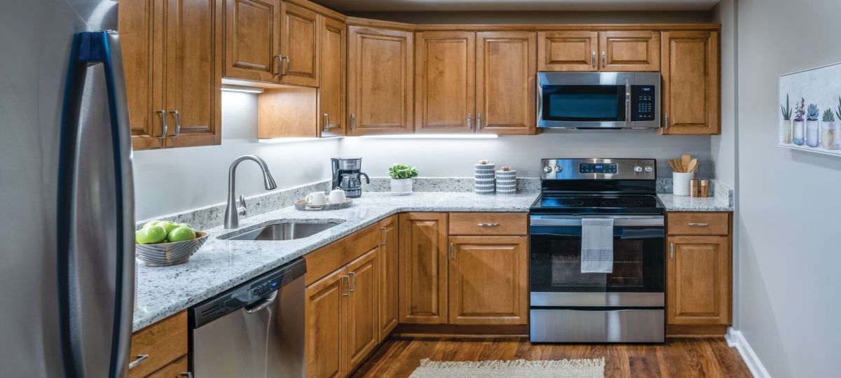 Modern kitchen in an Erickson Senior Living community apartment with stainless steel appliances.