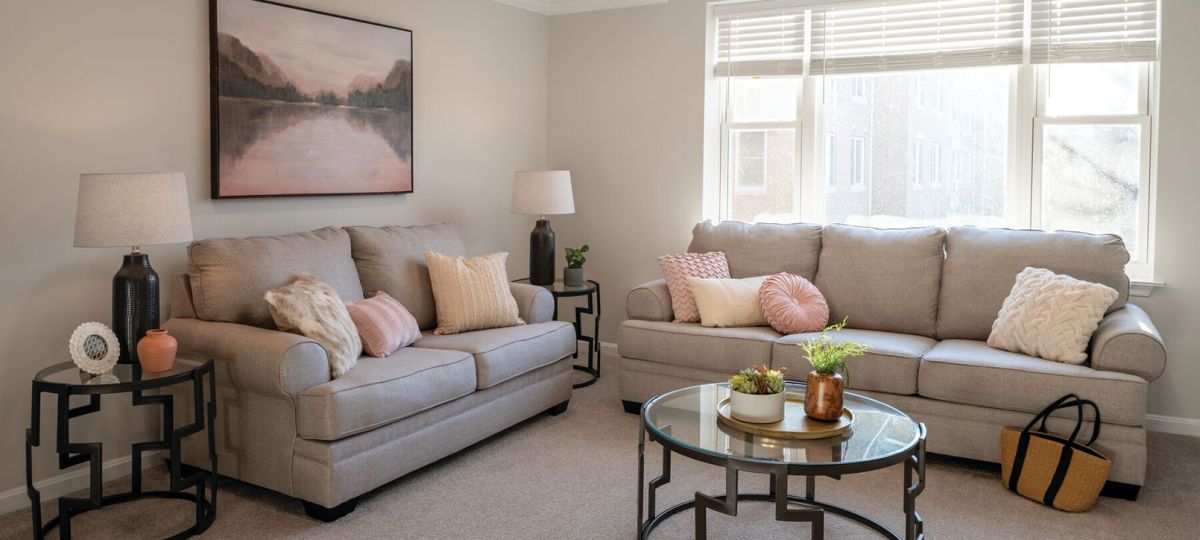 Comfortable and well-furnished living room in an Erickson Senior Living community apartment.