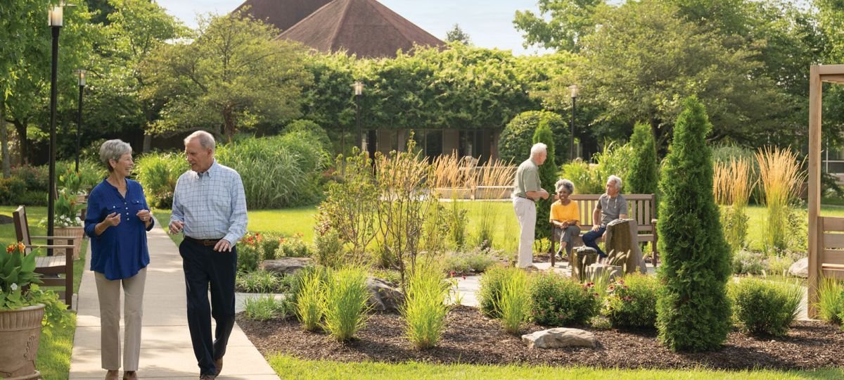 couple walking near garden