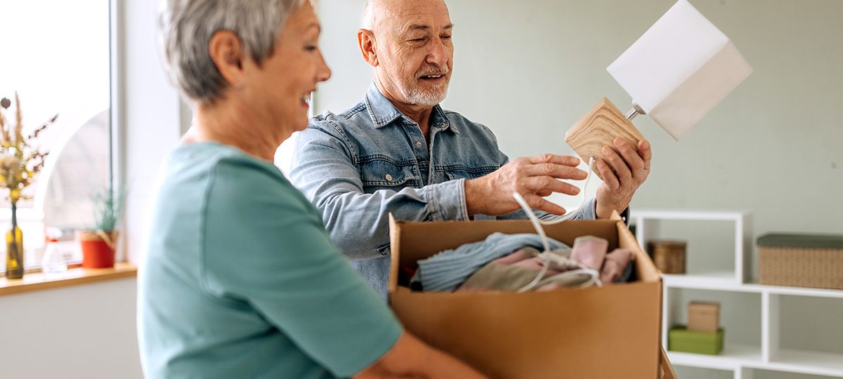 couple adding items to boxes
