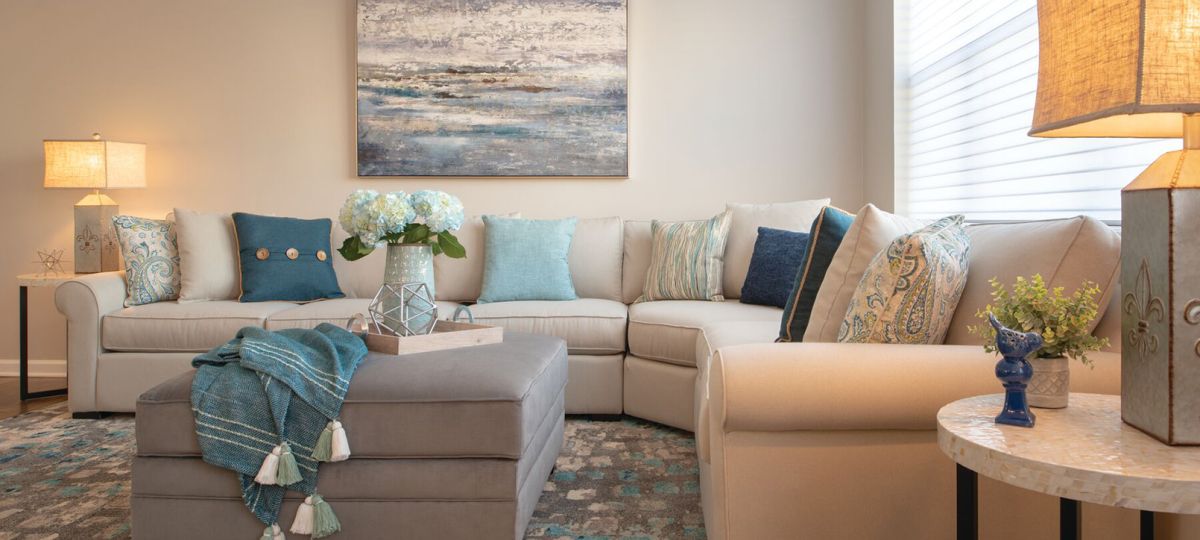 Close-up shot of a modern sofa and wall painting in a spacious Erickson apartment living room.