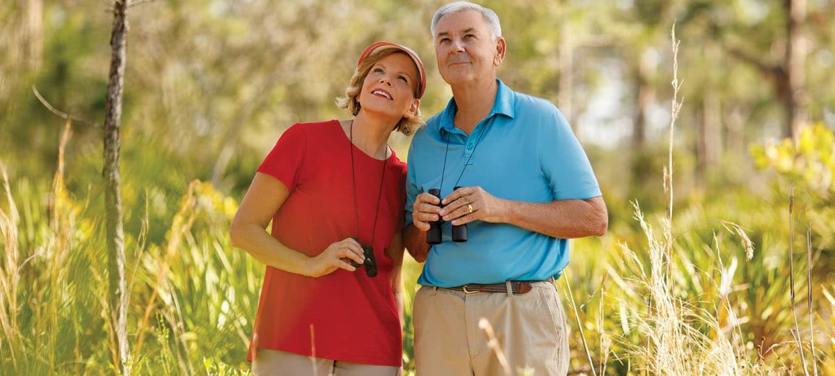 A couple birdwatching in the wilderness