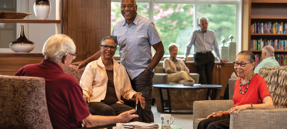 Residents having a conversation in the lounge