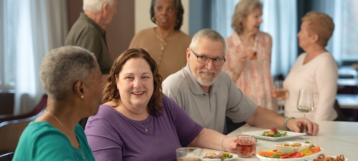 Residents enjoying a meal together