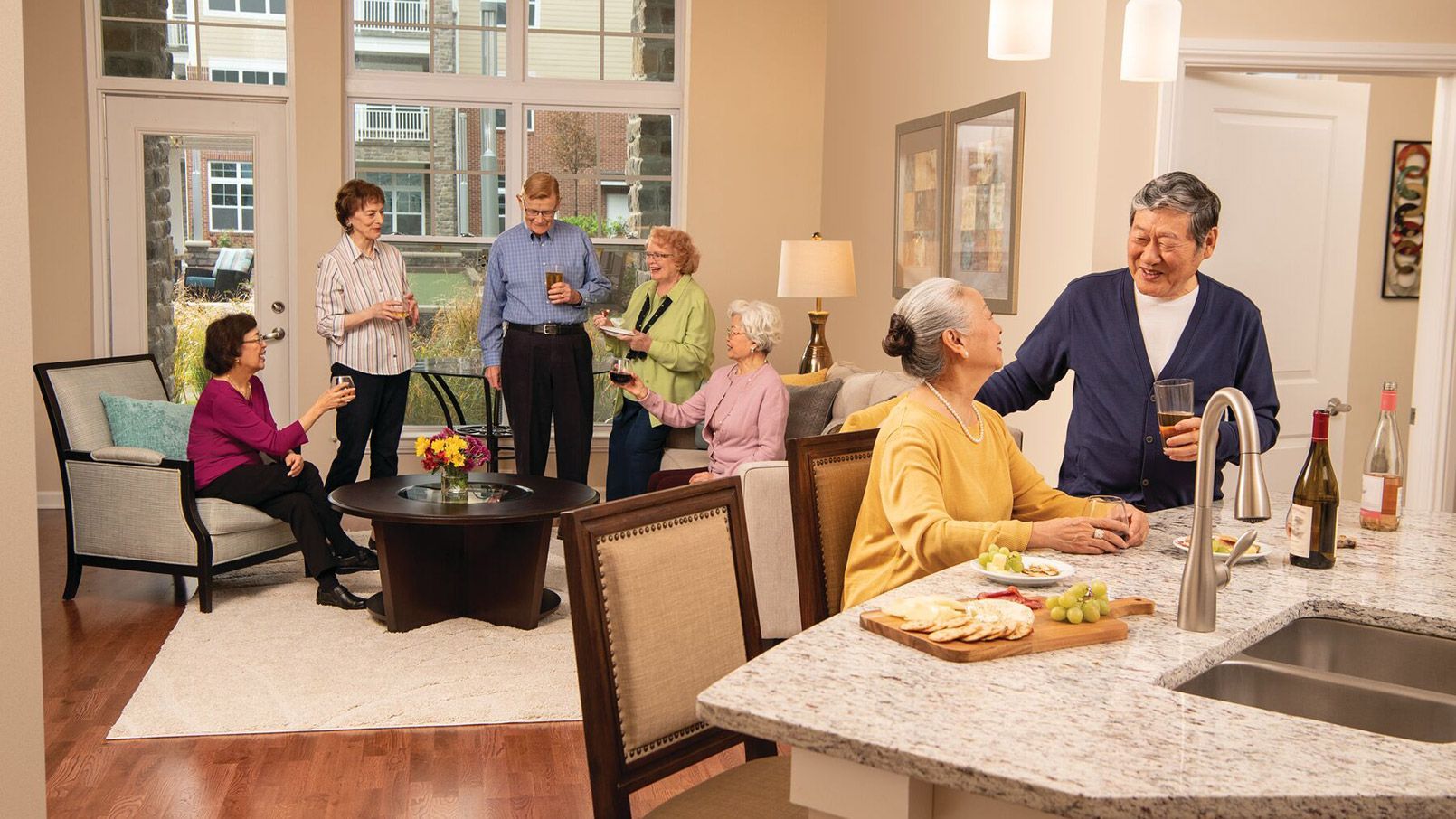 Residents enjoying a vibrant community atmosphere, socializing and connecting at an Erickson apartment.