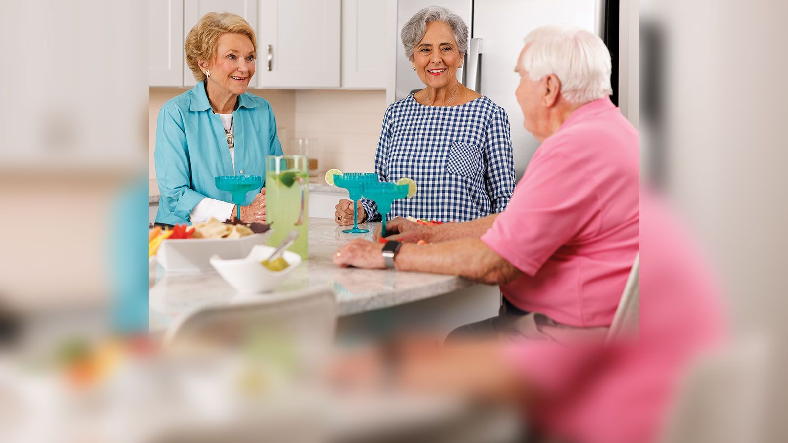 Residents enjoying drinks in a kitchen