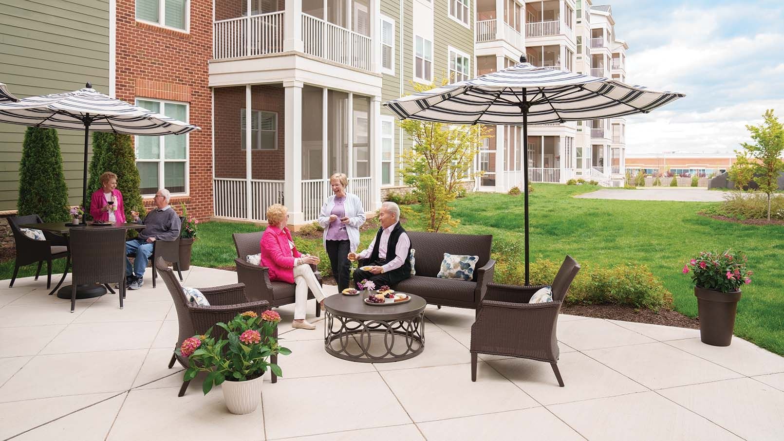 Residents sitting on the outdoor patio