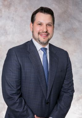 Professional headshot of Windsor Run Executive Director Michael Wehrle in a blue gray suit