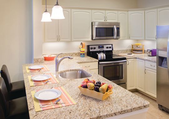 Large island just off of a modern kitchen.