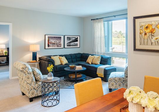 Bright, open living room with large windows.