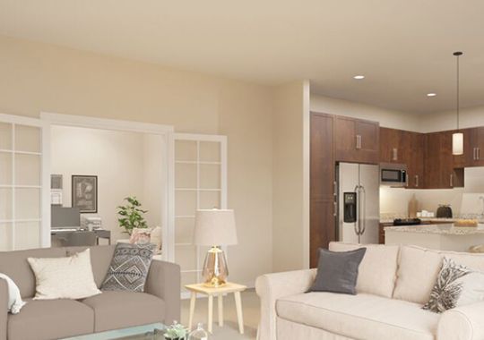 Spacious, furnished, open living room in an Erickson apartment home.
