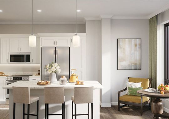 Interior shot of modern kitchen with stainless steel appliances inside of an Erickson two-bedroom apartment home.