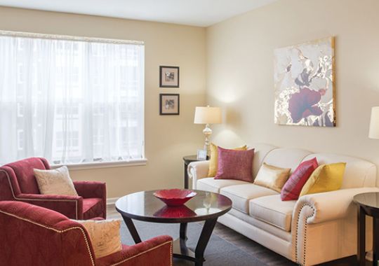 Comfortable and well-furnished living room in an Erickson Senior Living community apartment.