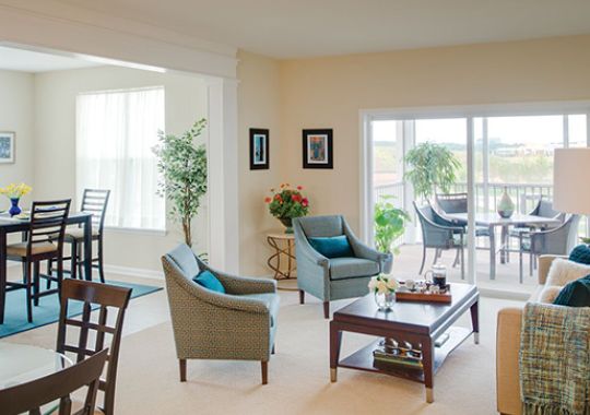 Comfortable and well-furnished living room in an Erickson Senior Living community apartment.