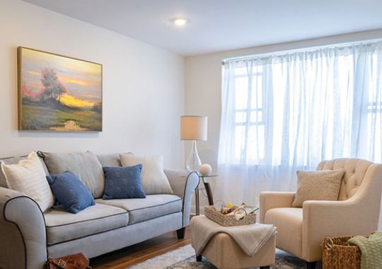 Comfortable and well-furnished living room in an Erickson Senior Living community apartment.
