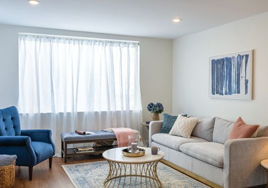 Comfortable and well-furnished living room in an Erickson Senior Living community apartment.
