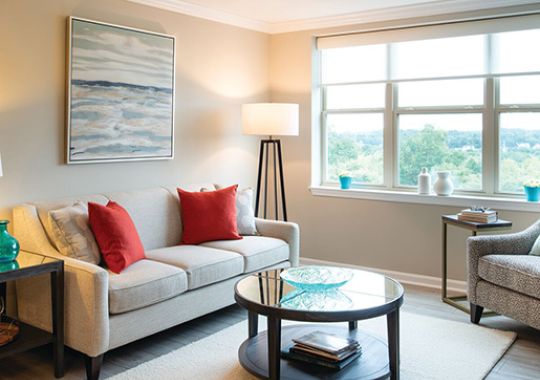 Comfortable and well-furnished living room in an Erickson Senior Living community apartment.