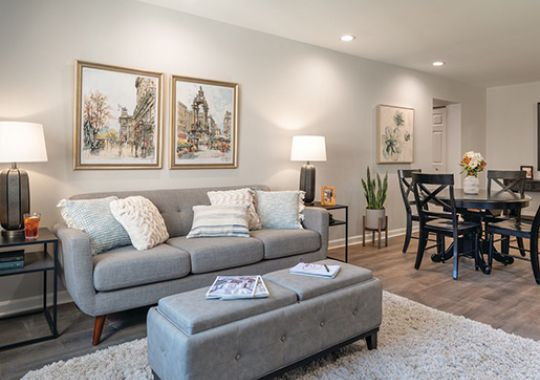 Comfortable and well-furnished living room in an Erickson Senior Living community apartment.