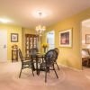 Image of a spacious living and dining area with a view into a den.