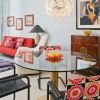 Room with round glass table and flowers