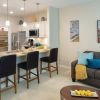 A bright modern kitchen and living area.