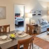 Open concept dining room with brown table and chairs.