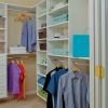 Walk-in closet inside bedroom of apartment home. 