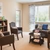 Open living room with styled bookshelf.