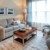 Interior shot of a nicely decorated living room in an Ericksonone-bedroom apartment.