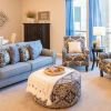 Interior shot of a nicely decorated, open living room in an Erickson two-bedroom apartment home. 