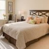 Interior shot of a cozy guest bedroom in an Erickson two-bedroom apartment.