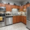 Interior shot of spacious kitchen with stainless steel appliances. 