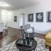 Interior shot of a nicely decorated, open living room in an Erickson two-bedroom apartment home. 