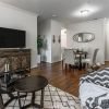 Interior shot of a nicely decorated, open living room in an Erickson two-bedroom apartment home. 