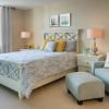 Interior shot of a cozy guest bedroom in an Erickson two-bedroom apartment.