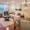 Interior shot of a nicely decorated, open living room in an Erickson two-bedroom apartment home. 