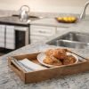 Close-up shot of a tray of pastries setting on top of a granite counter in the kitchen. 