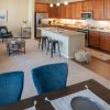 Interior shot of dining room and spacious kitchen. 