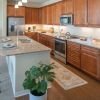 Interior shot of a bright kitchen and bar area in an Erickson one-bedroom apartment.