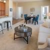 Wide shot of the living room and breakfast bar. 