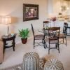 Interior shot of a nicely decorated, open living room in an Erickson two-bedroom apartment home. 