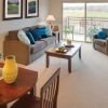 Interior shot of a nicely decorated, open living room in an Erickson two-bedroom apartment home. 