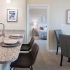 Interior shot of kitchen and breakfast bar inside of an Erickson two-bedroom apartment home. 