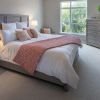 Interior shot of a cozy master bedroom in the Maplewood apartment.