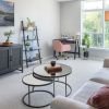 Interior shot of a nicely decorated living room in the Maplewood apartment.