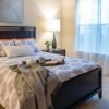 Interior shot of a cozy master bedroom in an Erickson apartment. 